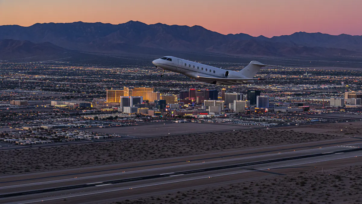 Private jet charter Las Vegas Private jet charter Las Vegas: business jet taking off with Las Vegas in the background