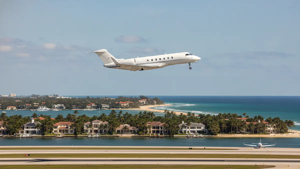 Private jet charter Palm Beach Private jet charter Palm Beach: business jet taking off with Palm Beach in the background