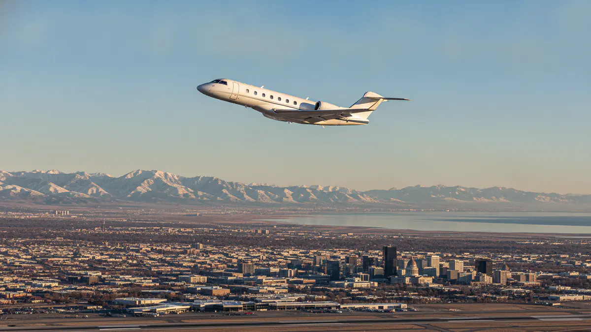 Private jet charter Salt Lake City: business jet taking off with Salt Lake City in the background