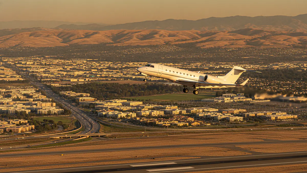 Private jet charter San Jose Private jet charter San Jose: business jet taking off with San Jose in the background