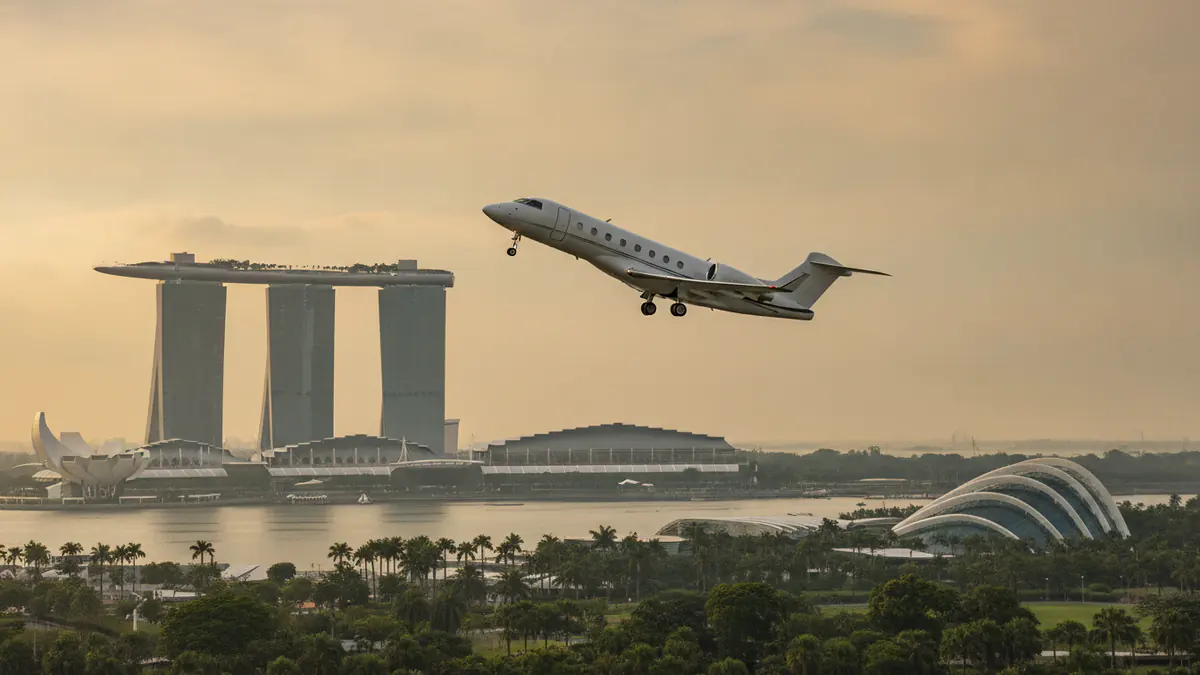 Private jet charter Singapore Private jet charter Singapore: business jet taking off with Singapore in the background
