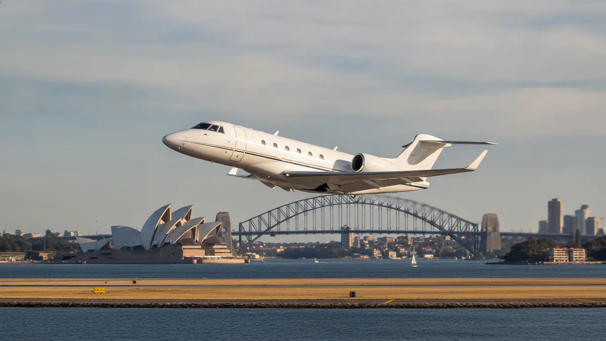 Private jet charter Sydney: business jet taking off with Sydney in the background
