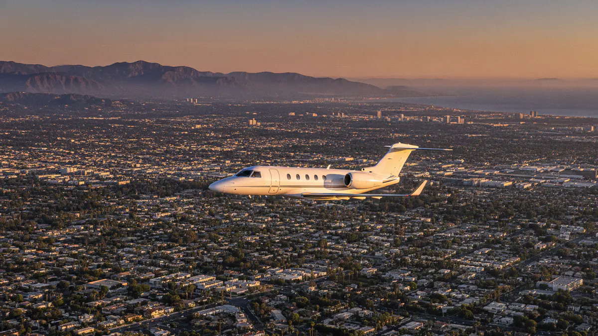 Private jet Denver to Los Angeles Private jet Denver to Los Angeles: light jet descending towards Los Angeles