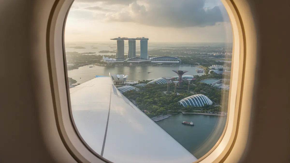 Private jet Dubai to Singapore Private jet Dubai to Singapore: cabin window view on approach to Singapore