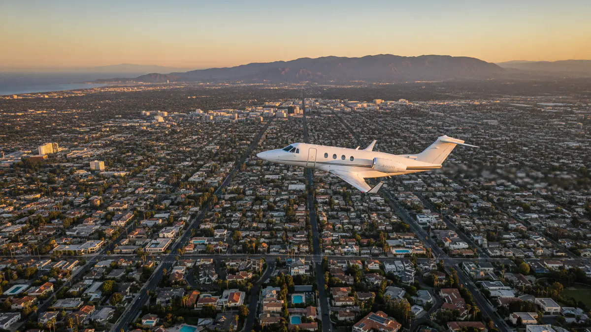 Private jet Los Angeles to Dallas: light jet climbing out of Los Angeles