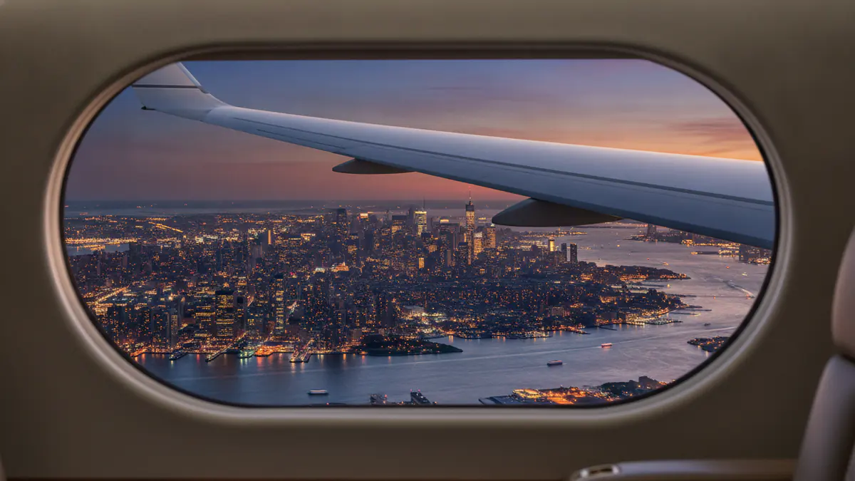 Private jet Madrid to New York: cabin window view on approach to New York
