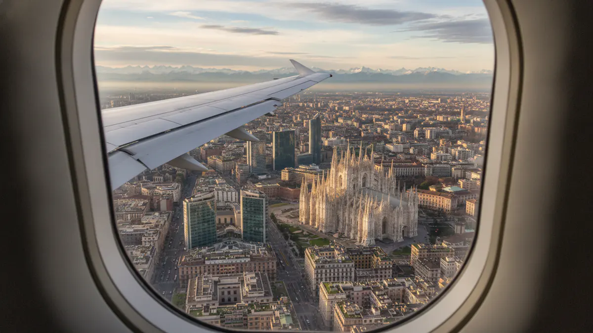 Private jet Munich to Milan Private jet Munich to Milan: cabin window view on approach to Milan