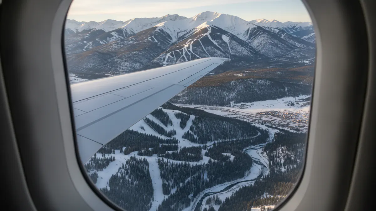 Private jet New York to Aspen Private jet New York to Aspen: cabin window view on approach to Aspen