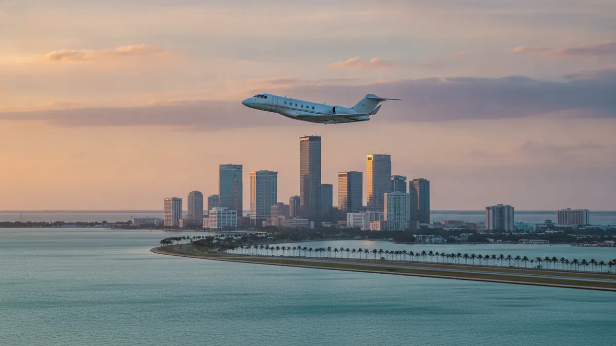 Tampa aircraft charter Tampa aircraft charter: business jet taking off with Tampa in the background