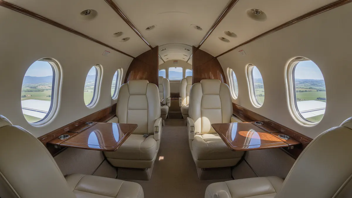 Turboprop charter Turboprop charter: turboprop cabin with leather seats and oval windows